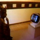 The TV Buddha installed at the AGNSW (1976). (video still from photograph: Stephen Jones) The TV Buddha installed at the AGNSW (1976). (video still from photograph: Stephen Jones)