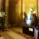 Paik and Moorman during a performance of the TV Cello in the entrance hall of the AGNSW (video still from photograph: Stephen Jones) Paik and Moorman during a performance of the TV Cello in the entrance hall of the AGNSW (video still from photograph: Stephen Jones)