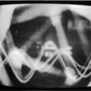Frame from Syntheses: with oscilloscope display of sound and video feedback.. Frame from Syntheses: with oscilloscope display of sound and video feedback..